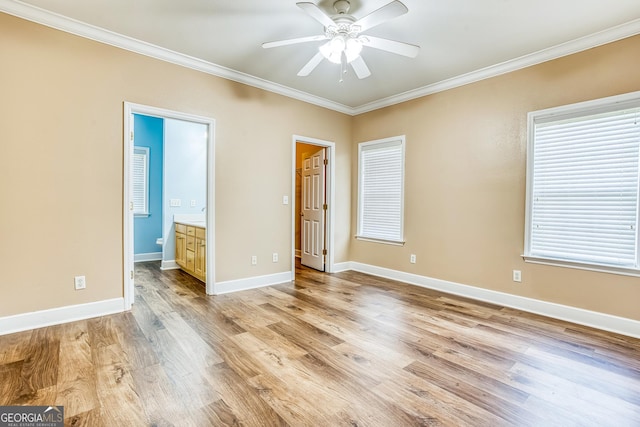 103 Mossy Creek Way, Ochlocknee, GA 31773 - unfurnished bedroom featuring ornamental molding, light wood-type flooring, baseboards, ensuite bath, and a ceiling fan