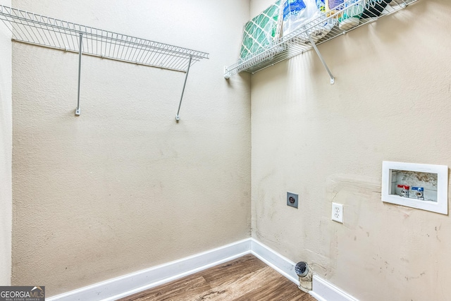 103 Mossy Creek Way, Ochlocknee, GA 31773 - laundry area with wood finished floors, electric dryer hookup, washer hookup, and baseboards
