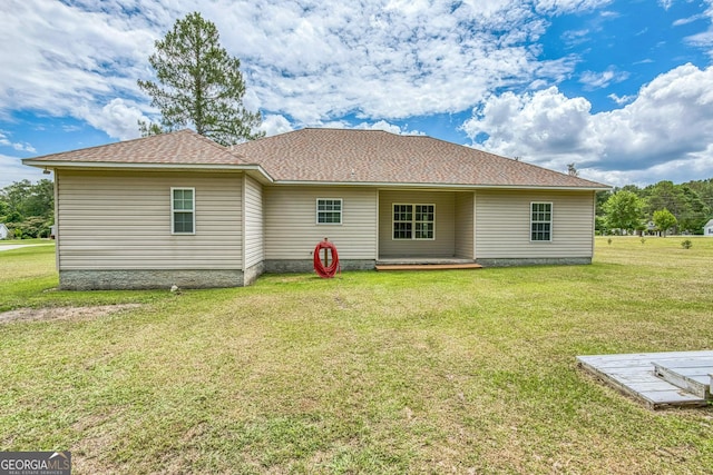 103 Mossy Creek Way, Ochlocknee, GA 31773 - back of property with a yard and roof with shingles