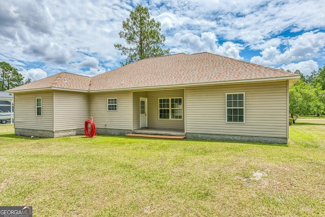 103 Mossy Creek Way, Ochlocknee, GA 31773 - back of house featuring a yard