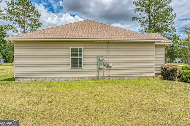 103 Mossy Creek Way, Ochlocknee, GA 31773 - view of side of home with a yard and roof with shingles