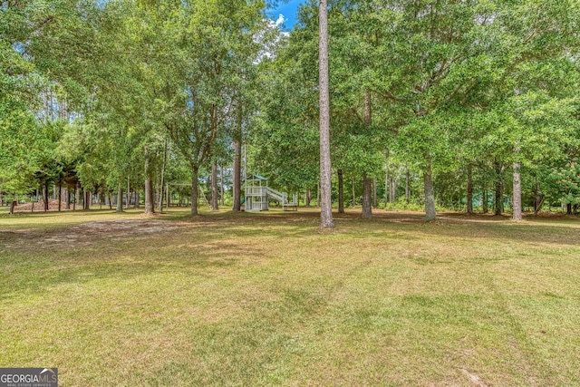 103 Mossy Creek Way, Ochlocknee, GA 31773 - view of grassy yard featuring view of wooded area