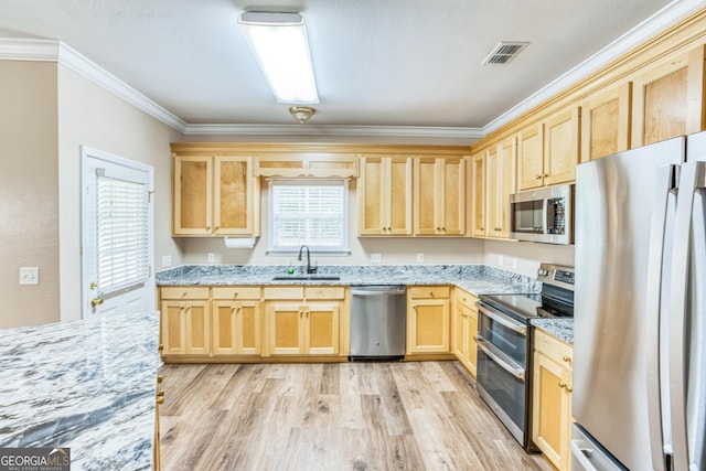 103 Mossy Creek Way, Ochlocknee, GA 31773 - kitchen featuring stainless steel appliances, light brown cabinets, a sink, crown molding, and light wood-style flooring