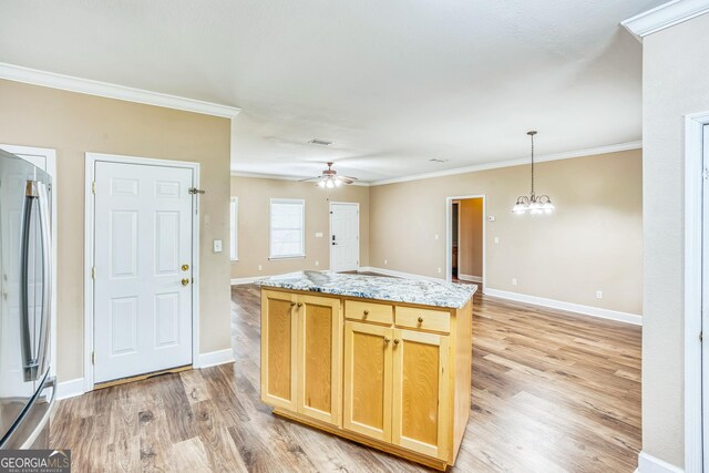 103 Mossy Creek Way, Ochlocknee, GA 31773 - kitchen featuring stainless steel fridge, light wood-style flooring, ornamental molding, ceiling fan, and open floor plan