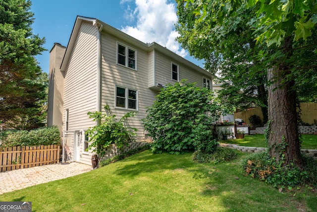 1005 Wellers Ct, Roswell, GA 30076 - view of home's exterior featuring a chimney