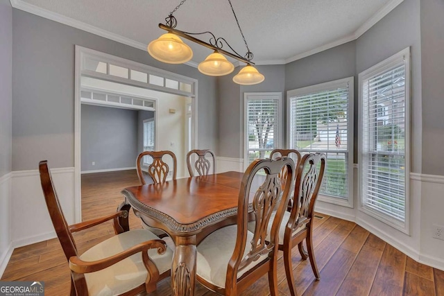 2018 Township Dr, Woodstock, GA 30189 - dining space with hardwood / wood-style floors, plenty of natural light, and crown molding