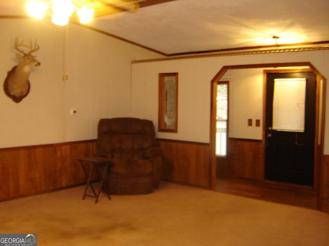 6177 County Road 266, Five Points, AL 36855 - living area with wainscoting, arched walkways, wooden walls, and crown molding