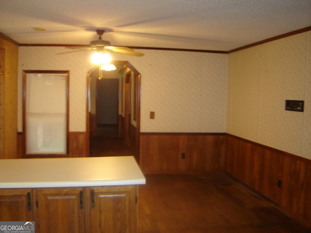 6177 County Road 266, Five Points, AL 36855 - unfurnished room featuring ceiling fan, ornamental molding, a wainscoted wall, wood finished floors, and a textured ceiling