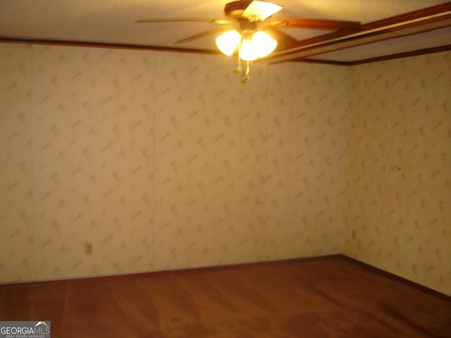 6177 County Road 266, Five Points, AL 36855 - unfurnished room featuring a ceiling fan and dark wood-style flooring