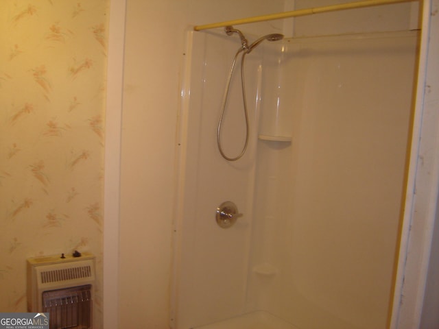 6177 County Road 266, Five Points, AL 36855 - full bathroom featuring wallpapered walls, heating unit, and a shower