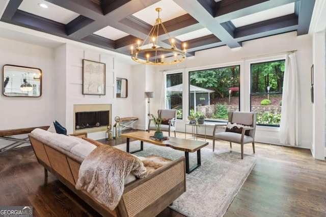4085 Hillcrest View Ct, Suwanee, GA 30024 - living area featuring a fireplace, plenty of natural light, a chandelier, beamed ceiling, and wood finished floors
