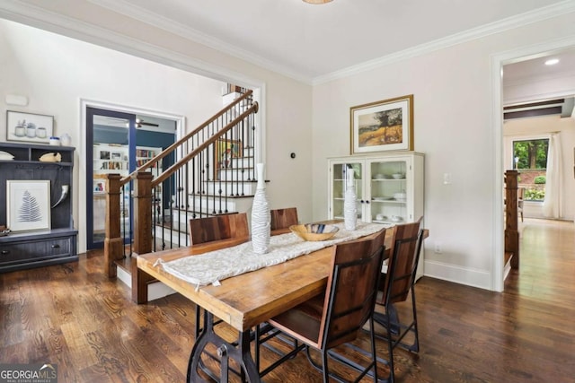 4085 Hillcrest View Ct, Suwanee, GA 30024 - dining area featuring wood finished floors, crown molding, baseboards, and stairway