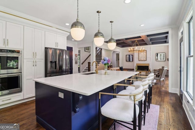 4085 Hillcrest View Ct, Suwanee, GA 30024 - kitchen with appliances with stainless steel finishes, recessed lighting, coffered ceiling, dark wood-type flooring, and a breakfast bar