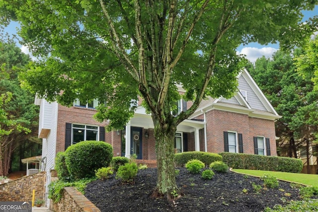 4085 Hillcrest View Ct, Suwanee, GA 30024 - view of property hidden behind natural elements featuring brick siding