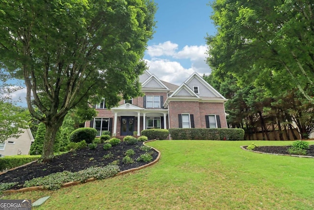 4085 Hillcrest View Ct, Suwanee, GA 30024 - view of front facade with brick siding and a front lawn