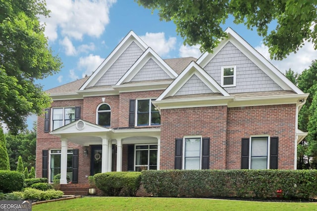 4085 Hillcrest View Ct, Suwanee, GA 30024 - view of front facade featuring brick siding and a front yard