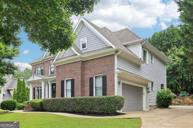 4085 Hillcrest View Ct, Suwanee, GA 30024 - view of front facade with driveway, an attached garage, brick siding, and a front yard