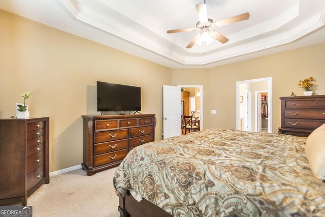 201 Loudon Hill Dr, Warner Robins, GA 31088 - bedroom with a tray ceiling, light carpet, ceiling fan, and baseboards