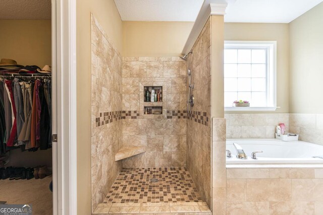 201 Loudon Hill Dr, Warner Robins, GA 31088 - bathroom with a bath, a tile shower, and a spacious closet