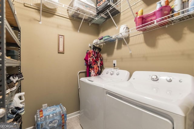 201 Loudon Hill Dr, Warner Robins, GA 31088 - laundry room featuring washing machine and clothes dryer, light tile patterned floors, and baseboards