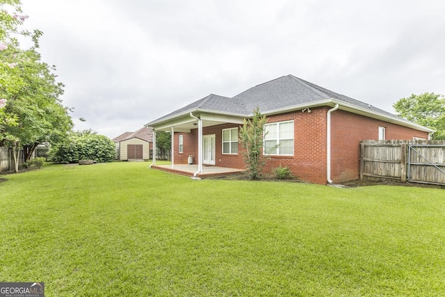 201 Loudon Hill Dr, Warner Robins, GA 31088 - rear view of property featuring brick siding, a patio, and roof with shingles