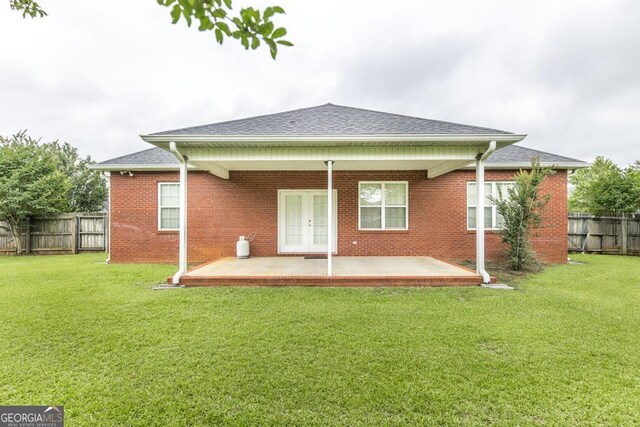 201 Loudon Hill Dr, Warner Robins, GA 31088 - back of house featuring a patio, french doors, brick siding, and a shingled roof