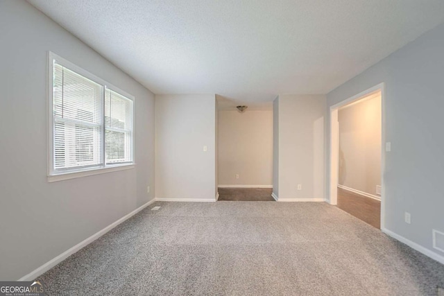 220 Harwell Rd NW, Atlanta, GA 30331 - empty room featuring carpet flooring, baseboards, and a textured ceiling