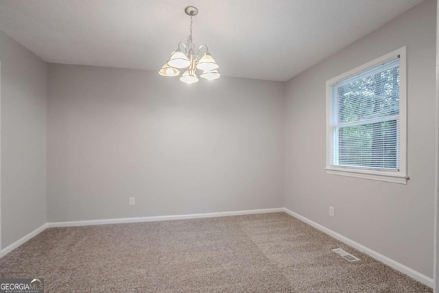 220 Harwell Rd NW, Atlanta, GA 30331 - carpeted empty room featuring a chandelier and baseboards