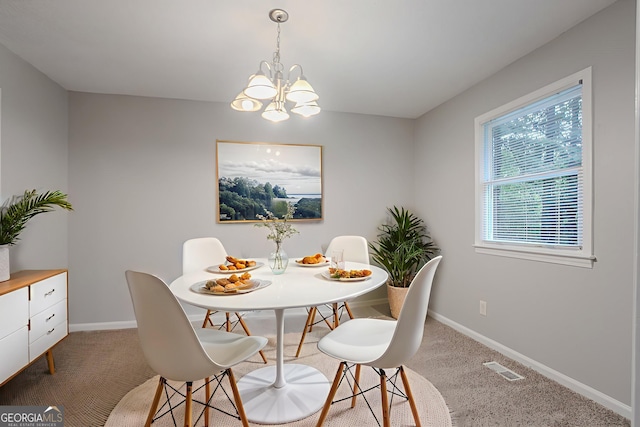220 Harwell Rd NW, Atlanta, GA 30331 - carpeted dining space featuring a chandelier and baseboards