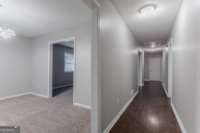 220 Harwell Rd NW, Atlanta, GA 30331 - hall with a textured ceiling, attic access, baseboards, and wood finished floors