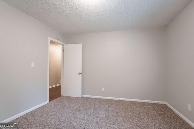 220 Harwell Rd NW, Atlanta, GA 30331 - spare room featuring carpet, a textured ceiling, and baseboards