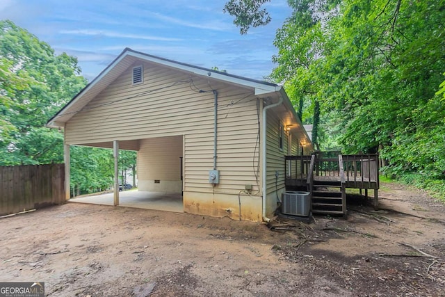 220 Harwell Rd NW, Atlanta, GA 30331 - view of home's exterior featuring a deck, crawl space, and central air condition unit