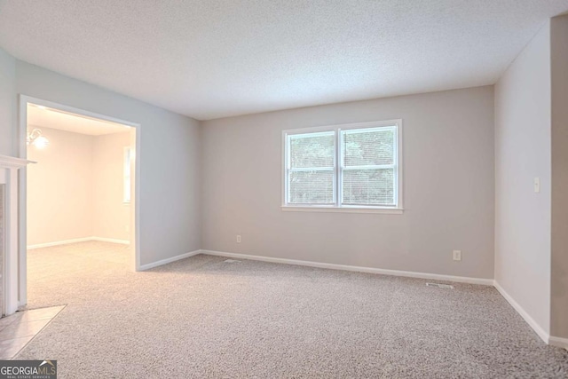 220 Harwell Rd NW, Atlanta, GA 30331 - spare room featuring light colored carpet, a textured ceiling, and baseboards