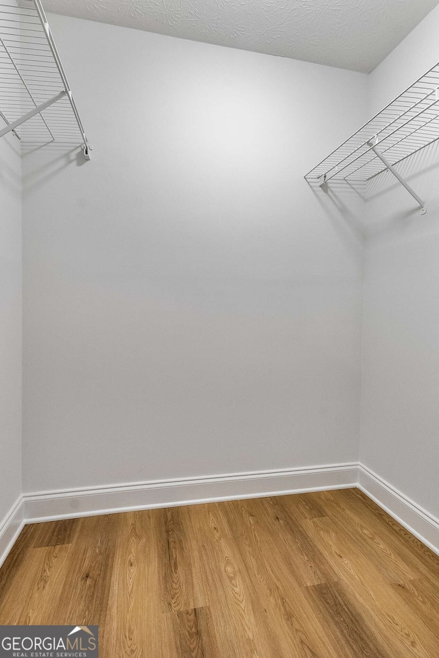 1603 Cumberland Ct, Smyrna, GA 30080 - walk in closet with light wood finished floors