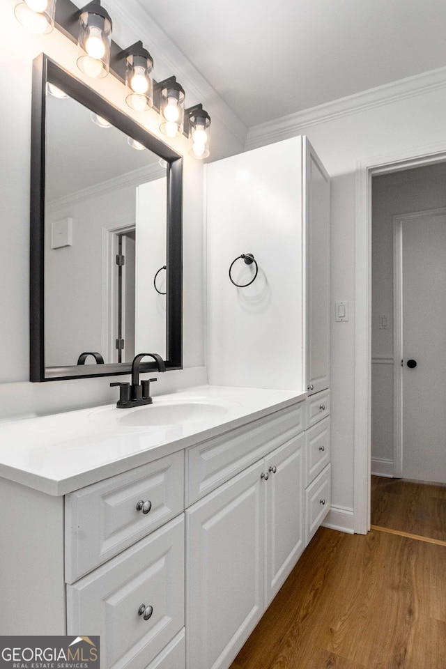 1603 Cumberland Ct, Smyrna, GA 30080 - bathroom featuring vanity, wood finished floors, and crown molding