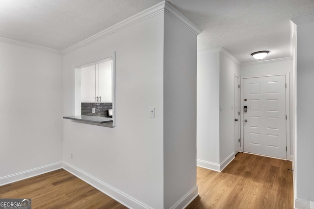1603 Cumberland Ct, Smyrna, GA 30080 - entrance foyer with wood finished floors, baseboards, crown molding, and a textured ceiling