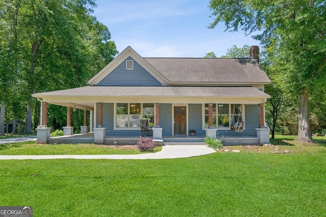 1382 6th Ave, Auburn, GA 30011 - view of front of property featuring a porch, roof with shingles, a front lawn, and a chimney