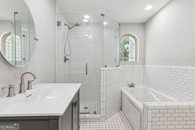 1382 6th Ave, Auburn, GA 30011 - bathroom with a shower stall, a jetted tub, vanity, and tile patterned flooring