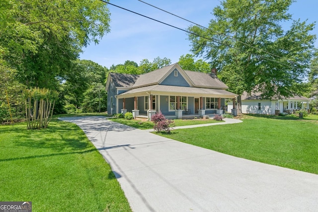 1382 6th Ave, Auburn, GA 30011 - view of front of property with a porch, concrete driveway, and a front yard