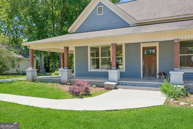 1382 6th Ave, Auburn, GA 30011 - view of front of property with a porch, a shingled roof, and a front yard