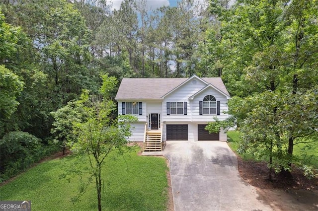 835 Navajo, Covington, GA 30016 - raised ranch with asphalt driveway, an attached garage, and a front yard