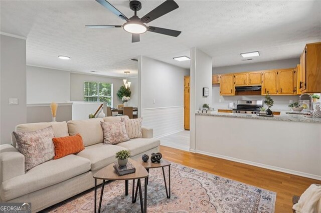 835 Navajo, Covington, GA 30016 - living room with light wood-style flooring, ceiling fan, and recessed lighting