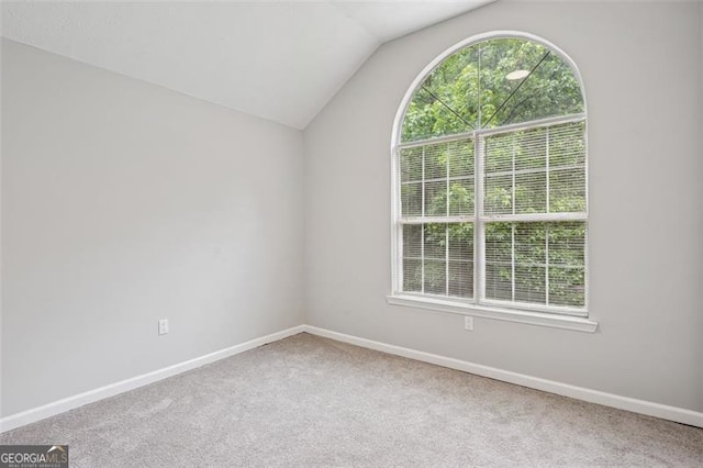 835 Navajo, Covington, GA 30016 - carpeted empty room featuring lofted ceiling and baseboards