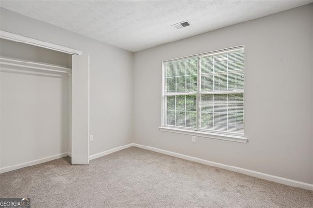 835 Navajo, Covington, GA 30016 - unfurnished bedroom featuring carpet and a closet