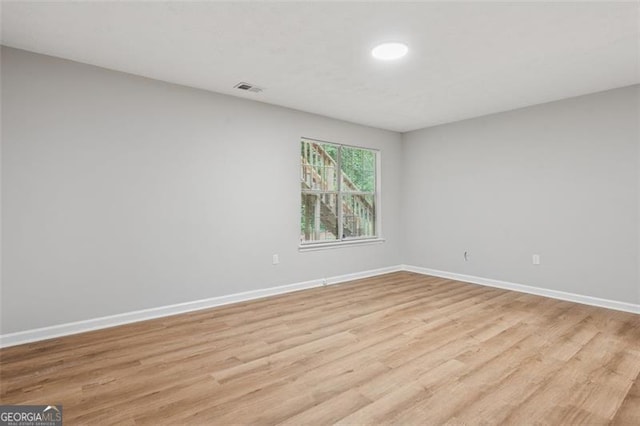 835 Navajo, Covington, GA 30016 - spare room with light wood-style flooring and baseboards