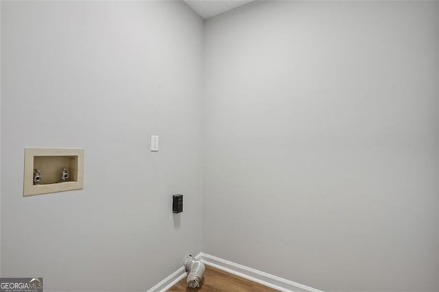 835 Navajo, Covington, GA 30016 - laundry area with washer hookup and dark wood-style flooring