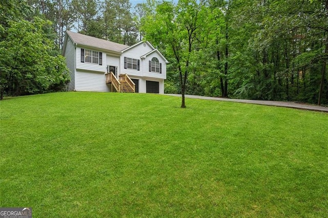 835 Navajo, Covington, GA 30016 - raised ranch with a garage, a front yard, and driveway