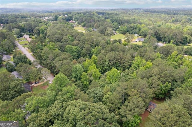 835 Navajo, Covington, GA 30016 - aerial view of property and surrounding area featuring a forest