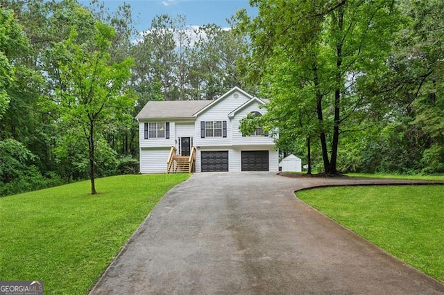 835 Navajo, Covington, GA 30016 - bi-level home featuring driveway, a front yard, and a garage