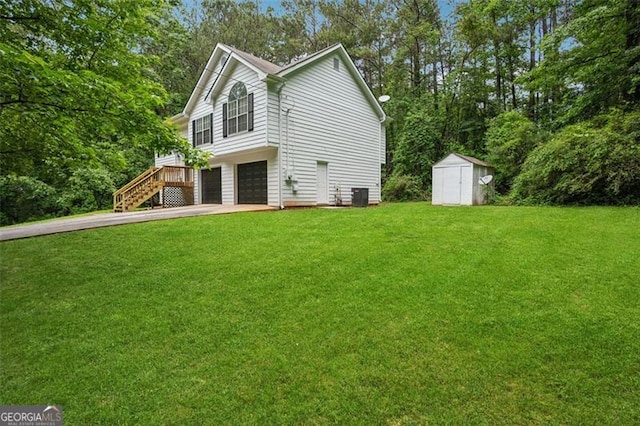 835 Navajo, Covington, GA 30016 - view of side of property with an attached garage, a shed, driveway, stairs, and a yard